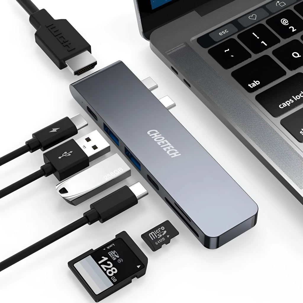 Silver aluminium USB-C hub adapter with SD card slot, HDMI, USB ports, and Thunderbolt 3