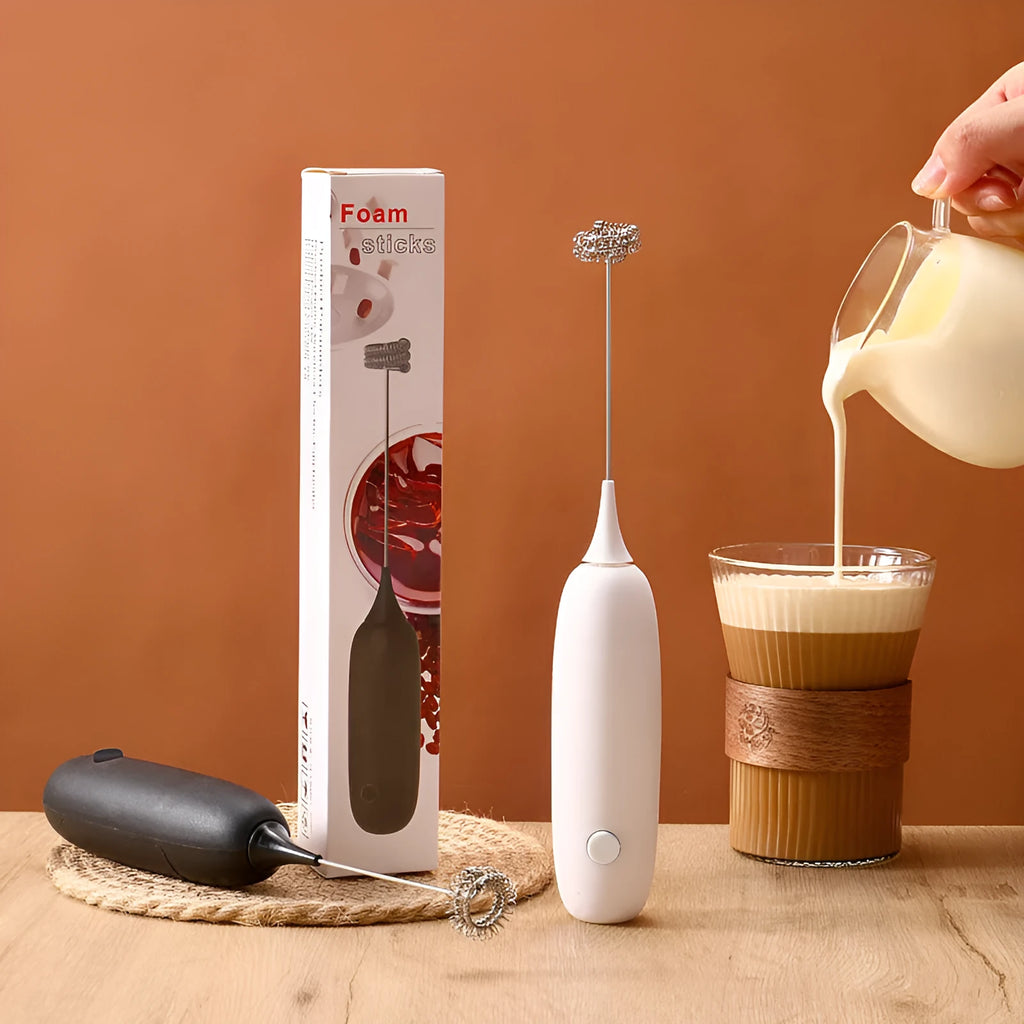 Black and white hand-held electric milk frother with blender function for coffee drinks