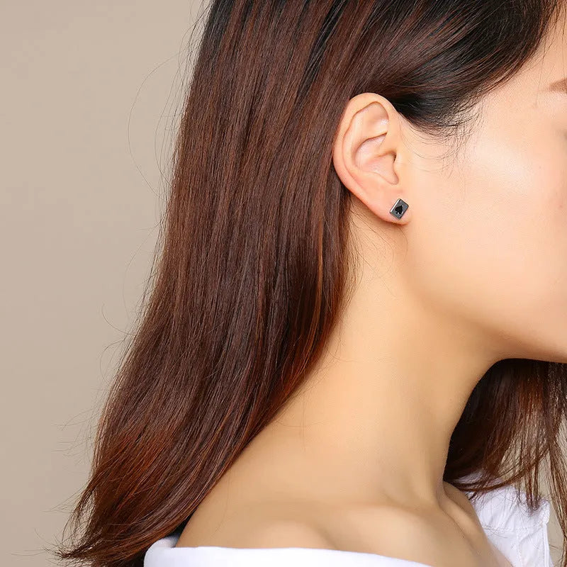 Black and white peach stud earrings with geometric quadrilateral shape in titanium steel, simple small design