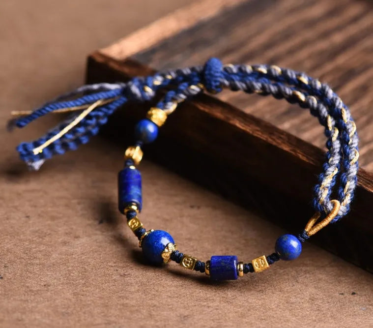 Close-up of a hand-woven flexible wire watch band in Lapis Lazuli blue colour.