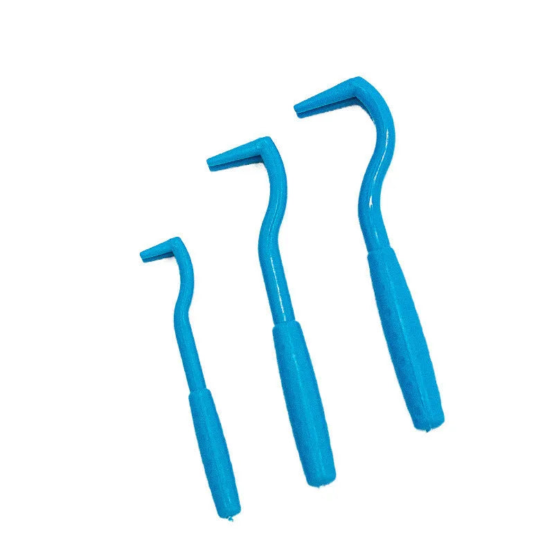 Three plastic tick removal clips for pets in blue and green colours