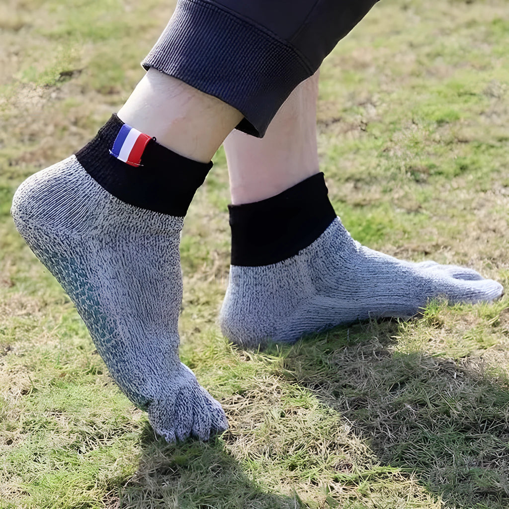 Grey five-toe cut-resistant anti-slip beach socks with non-slip silica gel sole against a neutral background