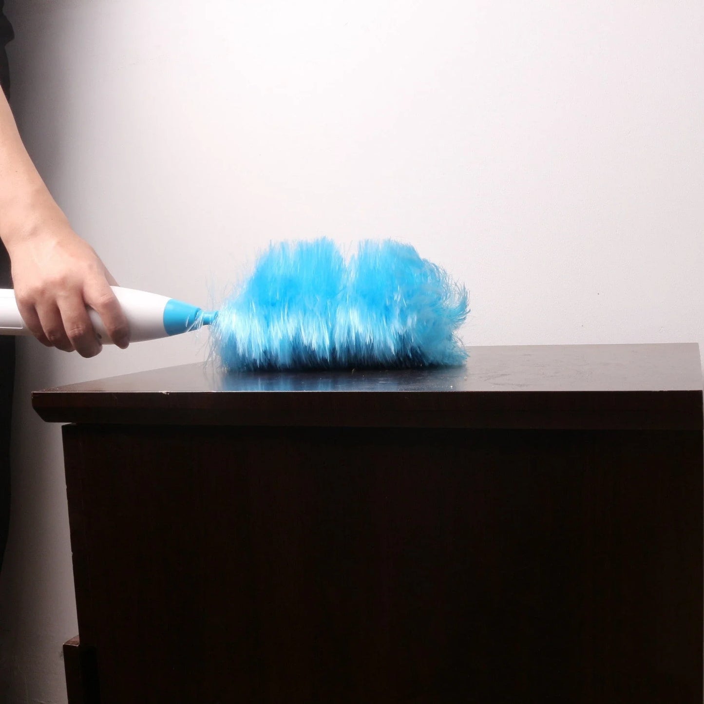 Adjustable electric feather duster with motorized feathers for effortless cleaning of furniture, blinds, and hard-to-reach areas