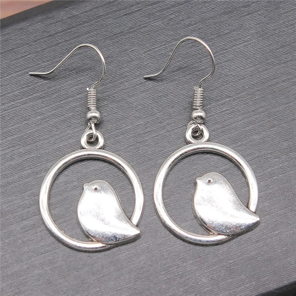 Retro simple handmade ornament bird earrings in ancient silver with zinc alloy body and iron ear hooks