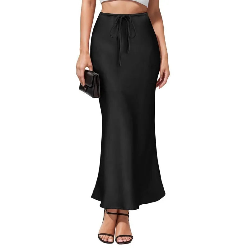 High-waisted asymmetric acetate satin skirt in a solid colour with irregular stitching detail.