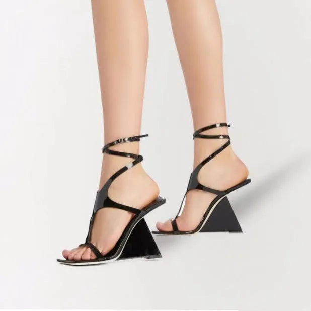Women's black square toe high heel sandals with a 9.5cm block heel and button fastening.