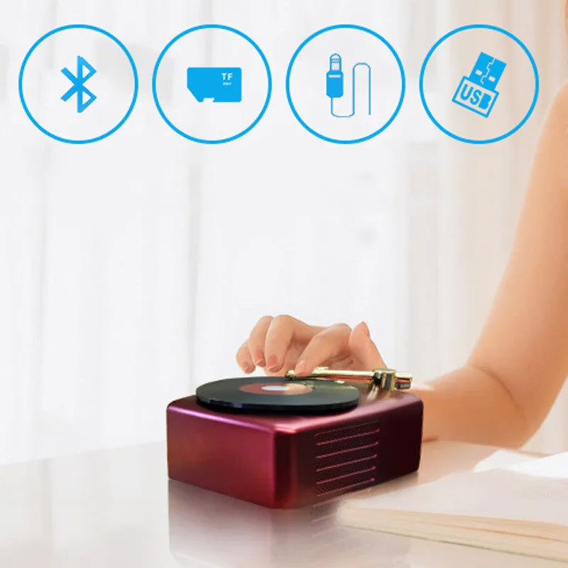 T12 compact Bluetooth record player with vinyl turntable, dual speakers, and wireless streaming in a black finish