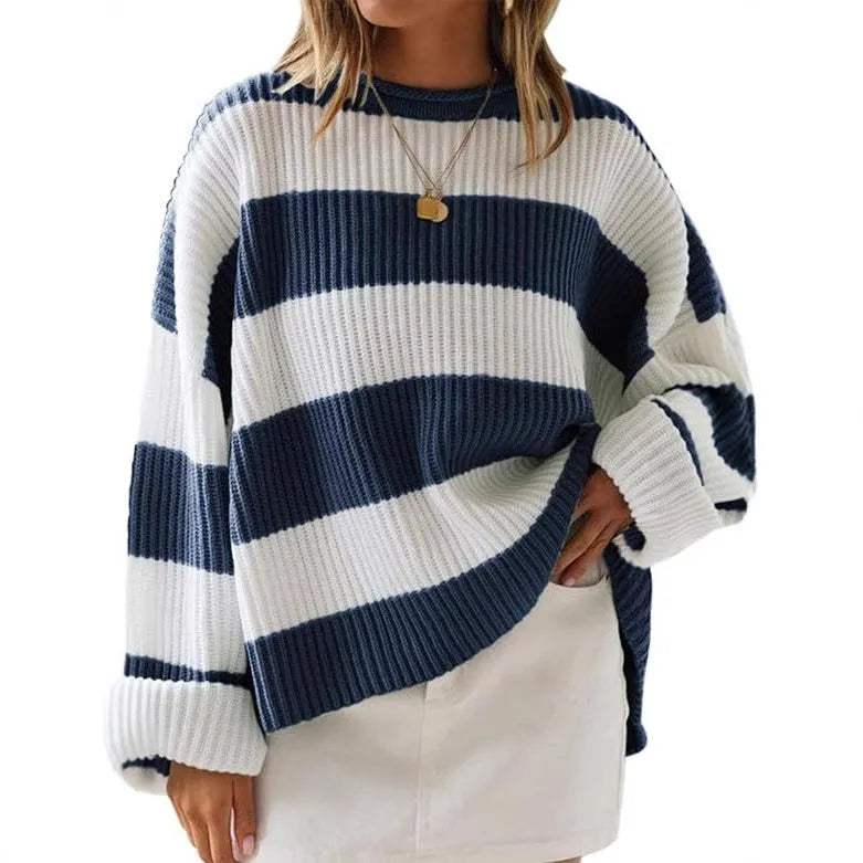 Women's loose striped sweater with long bell sleeves and white crocheted flower decoration on the front.