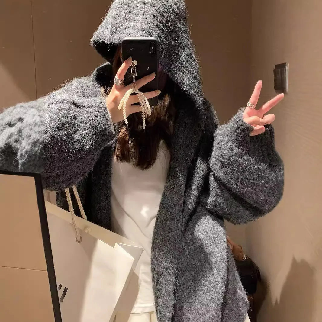 Women's dark grey retro-style hooded sweater cardigan on a hanger.