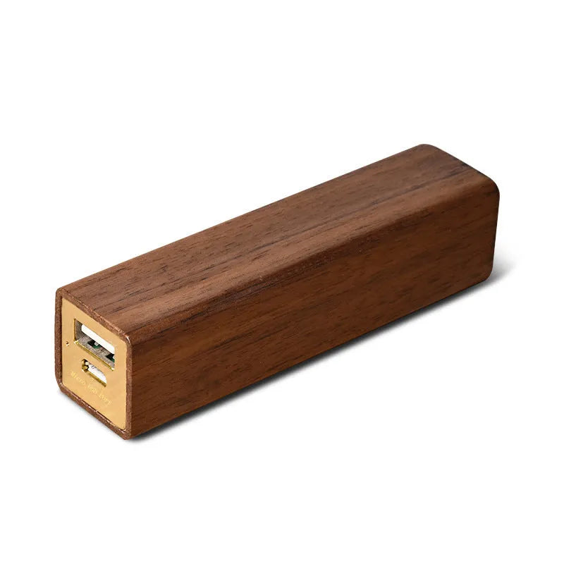 Black walnut wood portable power bank showing wooden casing with USB port and dimensions of 100mm x 25mm x 25mm