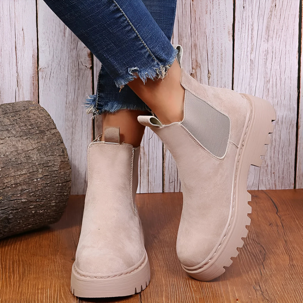 Women's Martin boots in solid colour with chunky platform sole, flat heel, and leather stitching