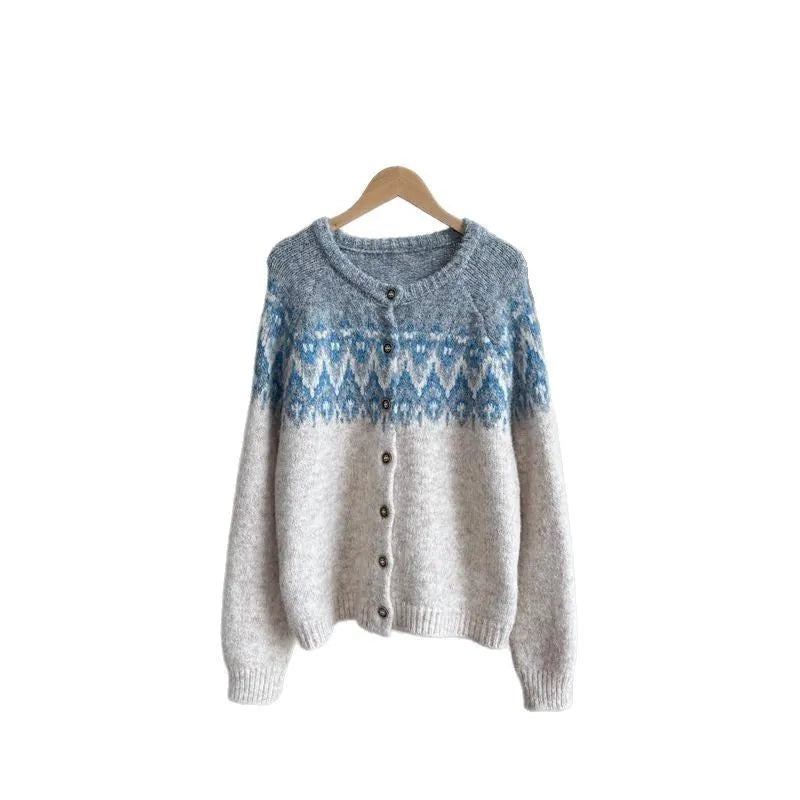 Women's loose beige jacquard knit coat sweater with long sleeves on a hanger