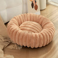 Round long-haired plush pet bed for dogs and cats, shown in beige, with size chart showing S, M, L, XL, XXL, XXXL options.