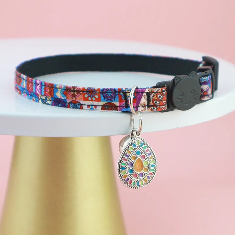 Adjustable polyester cat collar with locator protective cover in navy blue on a white background