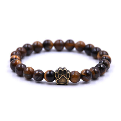 Natural stone dog paw bracelet featuring tiger eye and volcanic stone in a unisex design