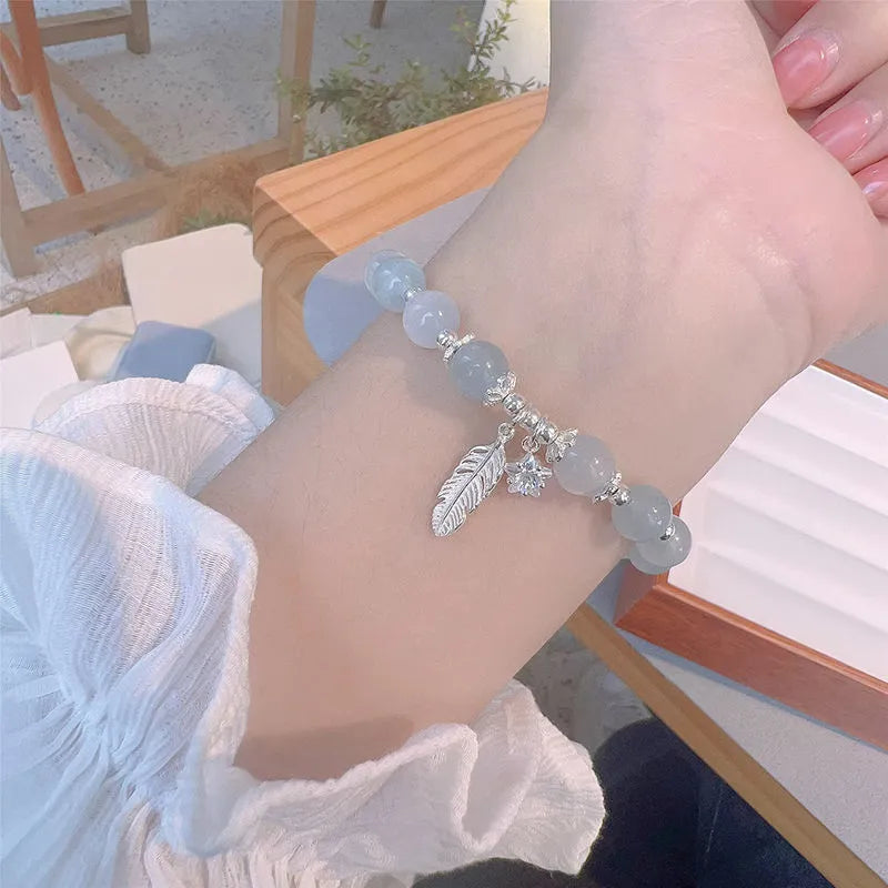 Korean style crystal bracelet with blue moonlight glass beads and eight pointed star charm