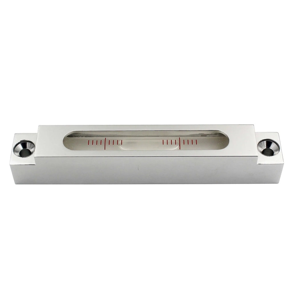 Close-up of a small metal and glass mini strip level showing bubble vials.