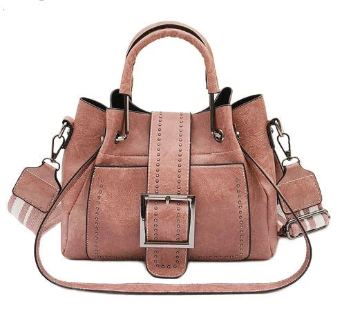 Stylish double-layer cowhide leather bucket bag with chic hardware accents, available in black, pink, and brown colors