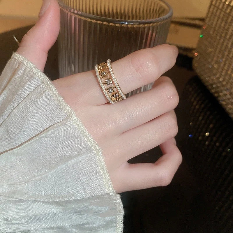 Pearl Hollowed-out Square Open-end Zircon Ring in gold, showcasing unique geometric design