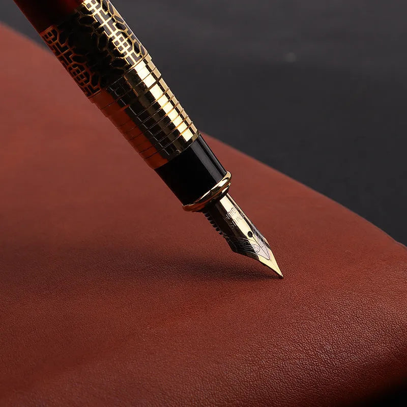 Imitation mahogany metal wood grain fountain pen with 0.5mm tip and black ink refill on desk