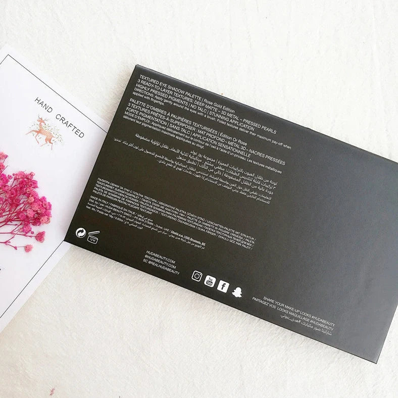 Rose gold eyeshadow palette with 35 warm neutral tones showing matte and shimmer finishes