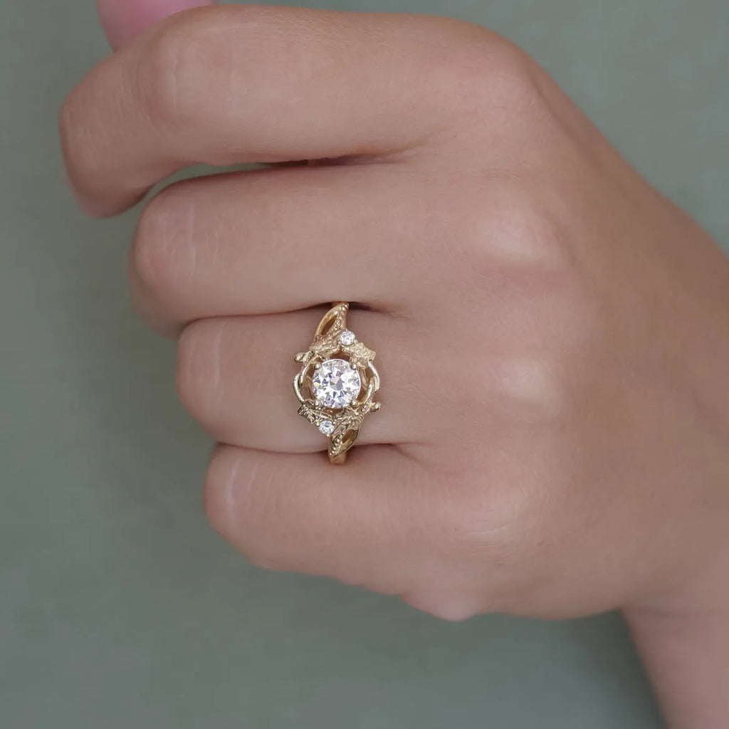 Gold alloy unisex ring with brushed finish on white background