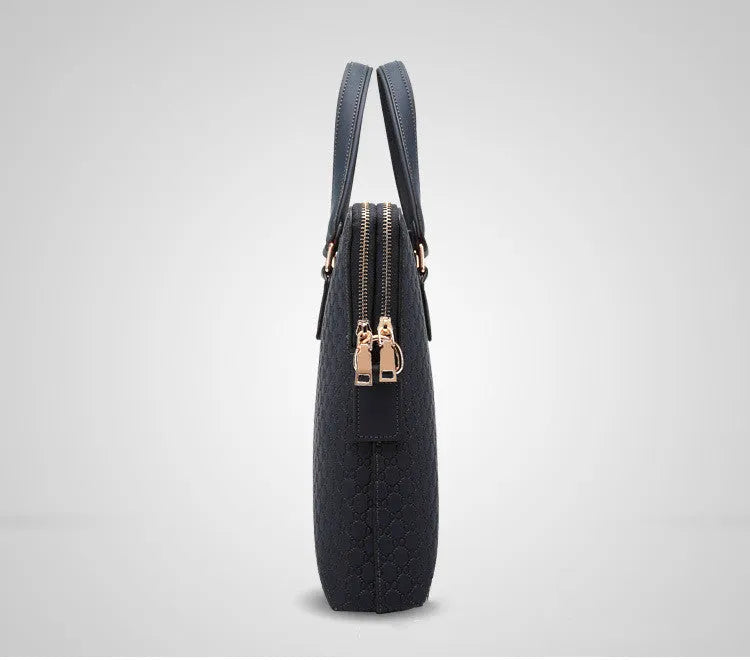 Genuine leather men's business handbag in blue with embossed geometric pattern, soft handles, and zipper closure, designed for a 14-inch laptop