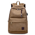 Canvas backpack with USB charging port in grey colour, showing front compartment and shoulder straps.
