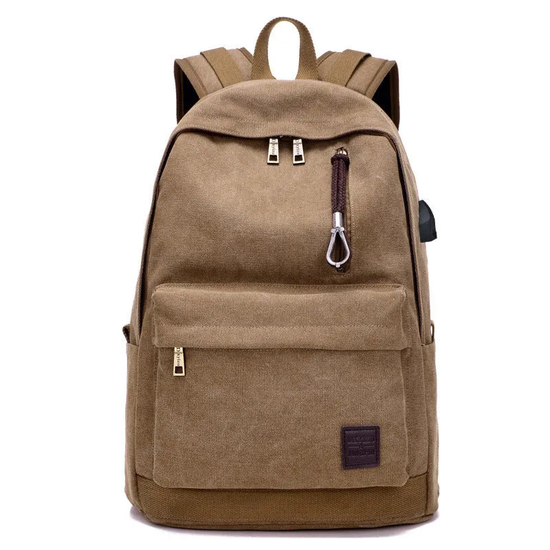 Canvas backpack with USB charging port in grey colour, showing front compartment and shoulder straps.