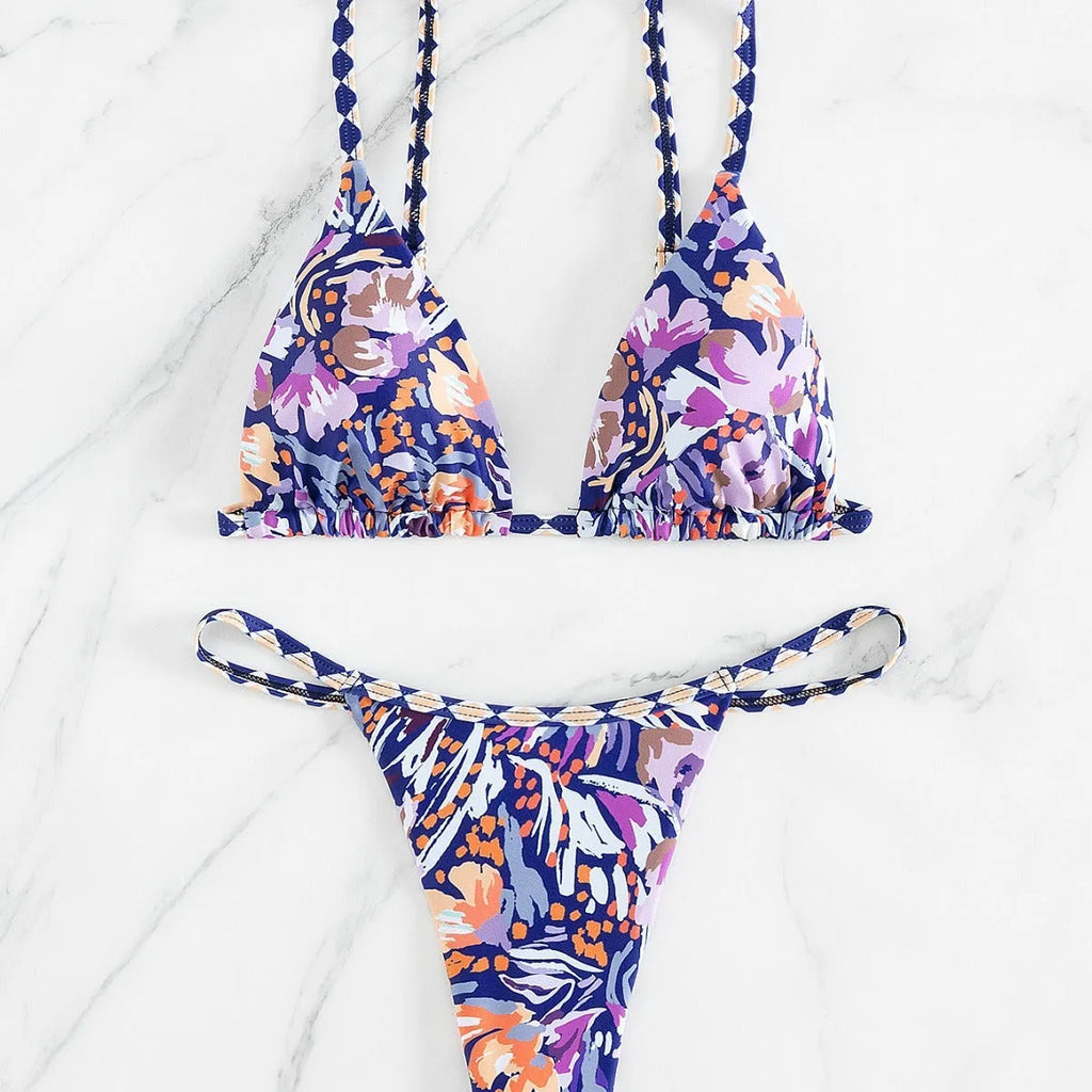 Women's floral print one-piece swimsuit with triangle bag design and split back in polyester.