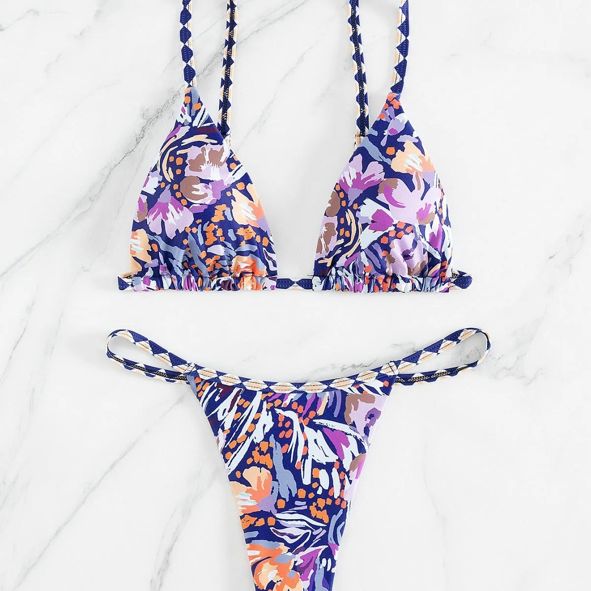 Women's floral print one-piece swimsuit with triangle bag design and split back in polyester.