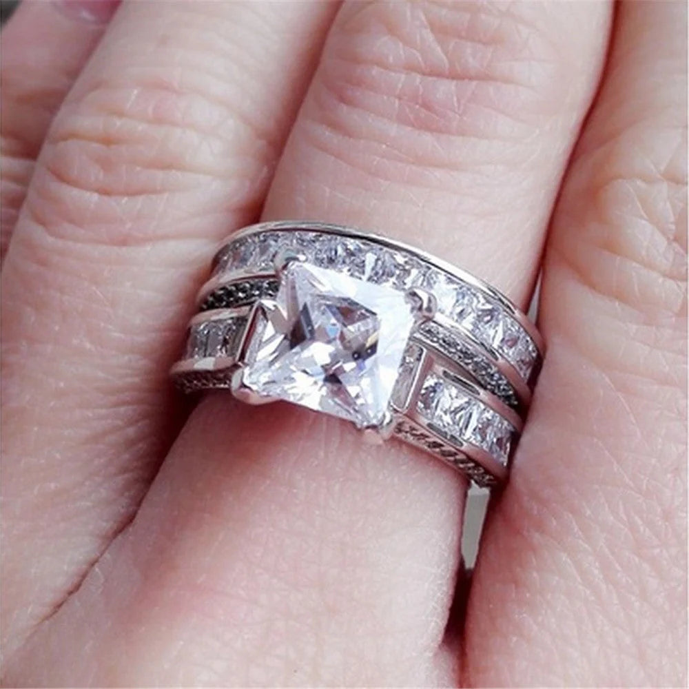 Silver charm couple rings with princess cut CZ, perfect for anniversaries, promises, or engagements
