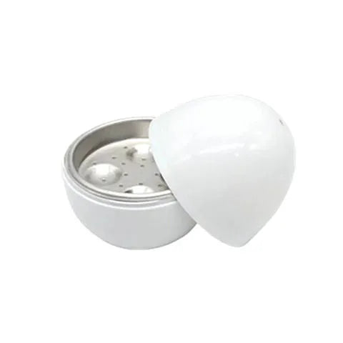 White microwave egg steamer cooker with lid, showing capacity for four eggs on a kitchen counter.