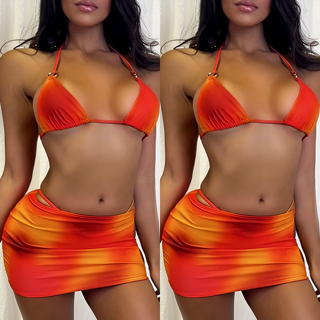 Tie-dye gradient three-piece halter bikini set on a mannequin, showing top, pants, and skirt.