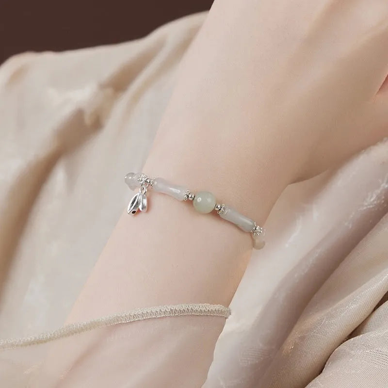 Women's antique-style bracelet made from Tianshan green bamboo and sterling silver with bamboo joint detailing.