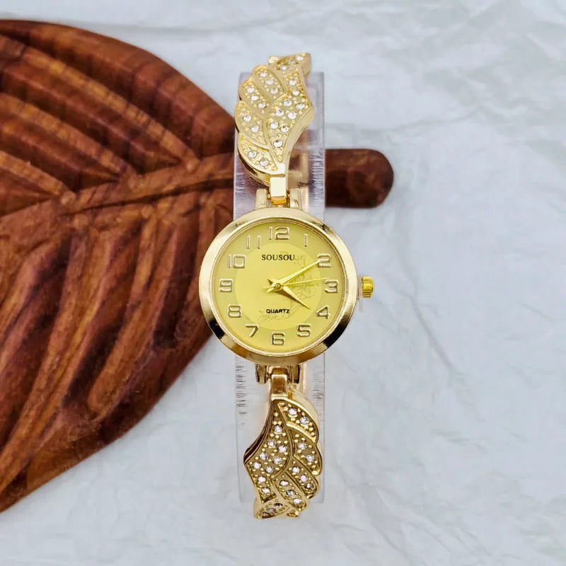Stainless steel women's watch with round dial on a metal strap with Vachette clasp, shown in gold colour.