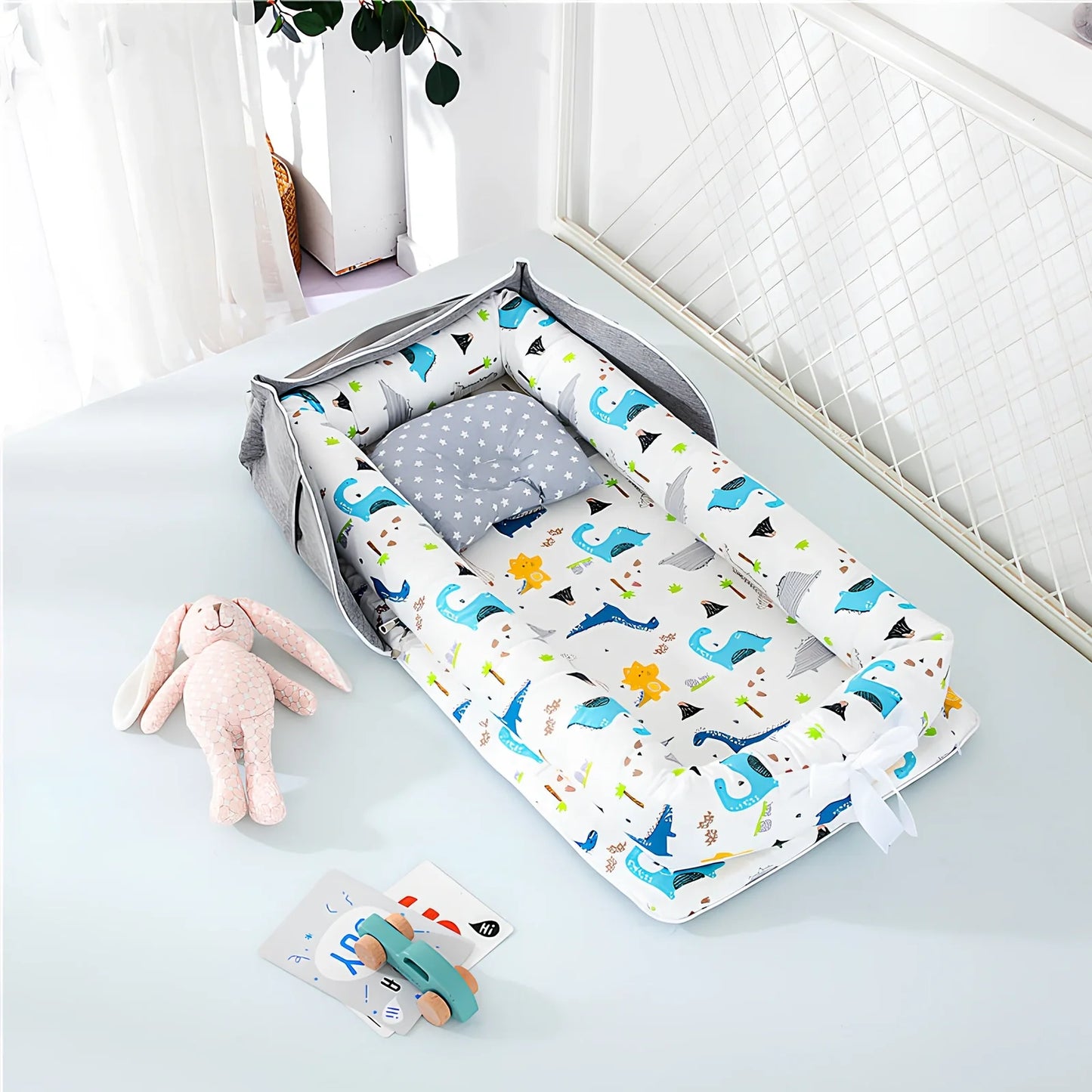 Foldable cotton portable baby crib in Animal World Blue, 90x50 cm with pillow and strap, weighing 1.3 kg
