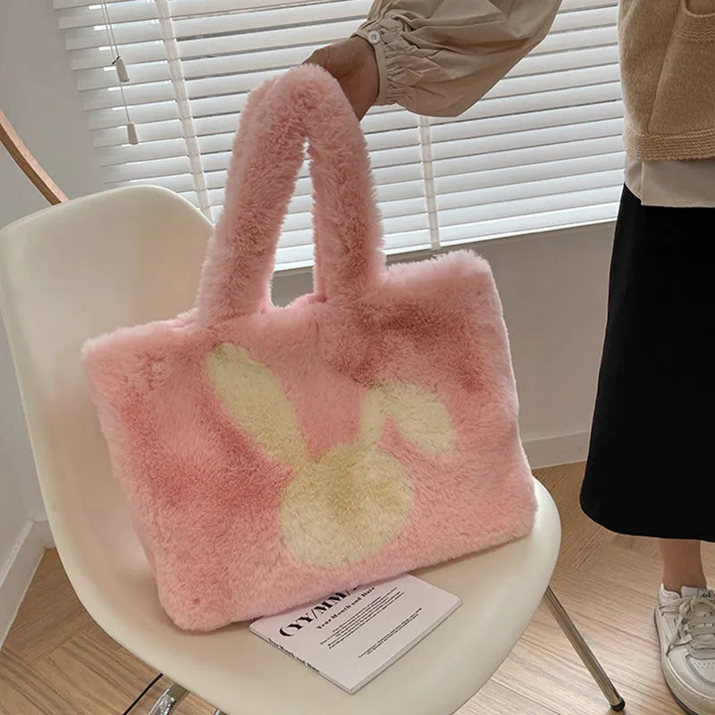 Soft plush tote bag with cartoon rabbit ears in one of six solid colours.