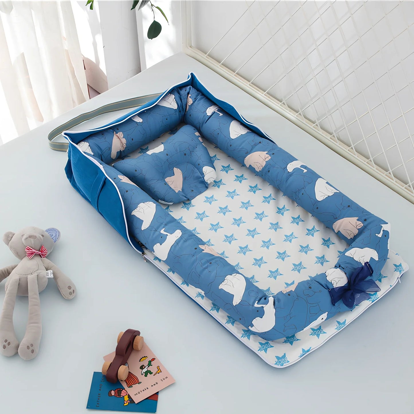 Foldable cotton portable baby crib in Animal World Blue, 90x50 cm with pillow and strap, weighing 1.3 kg