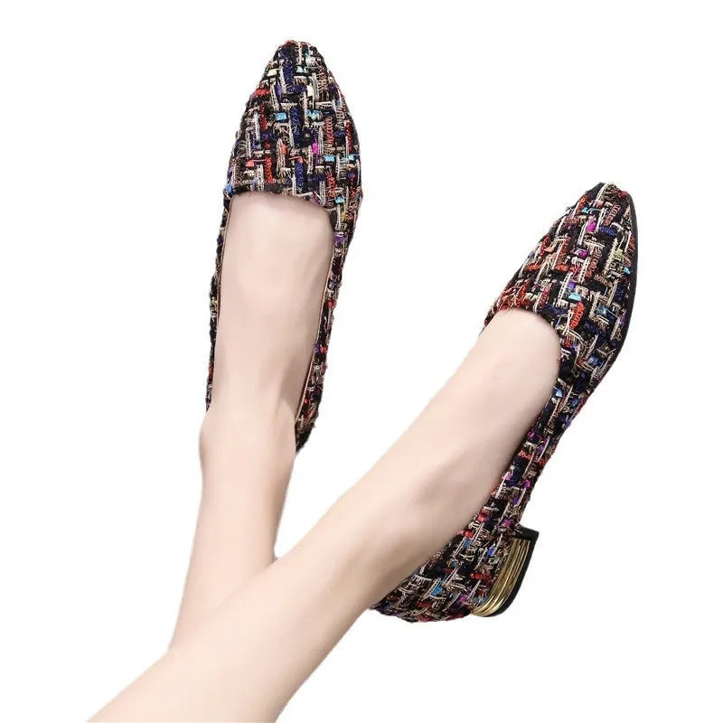 Women's black and white canvas casual shoes with pointed toe and flat rubber sole