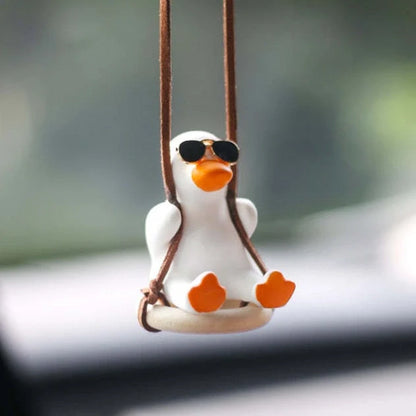 Gypsum duck ornament with swing tire design measuring 6x5x6cm for decorative displays