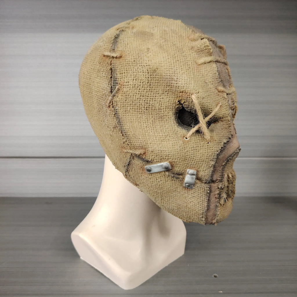 Latex Halloween horror mask with scar skull design showing dimensions of 31cm height