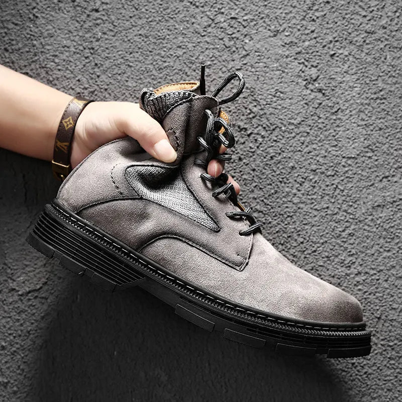 Men's frosted brown Martin boot with round toe and thick rubber sole on a grey background.