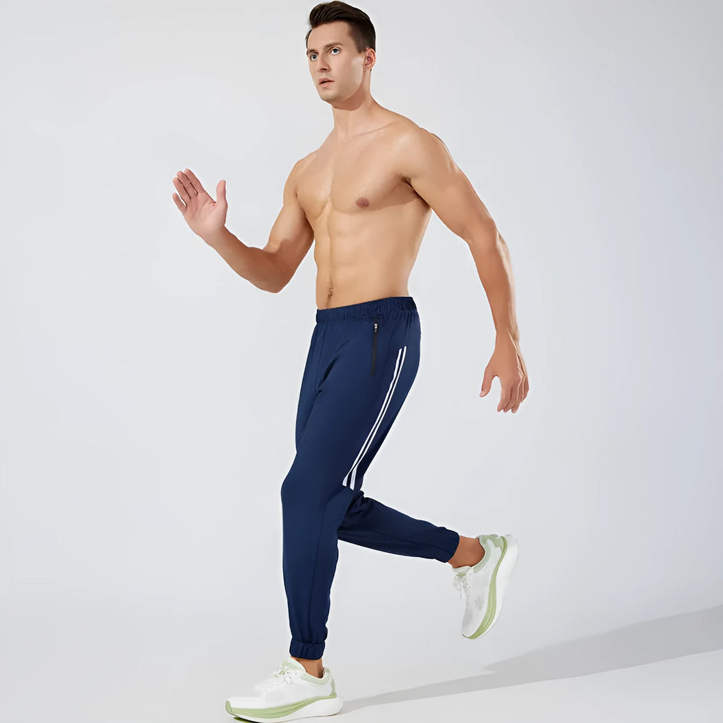 Men's black polyester running trousers with a mid-waist and full-length leg.