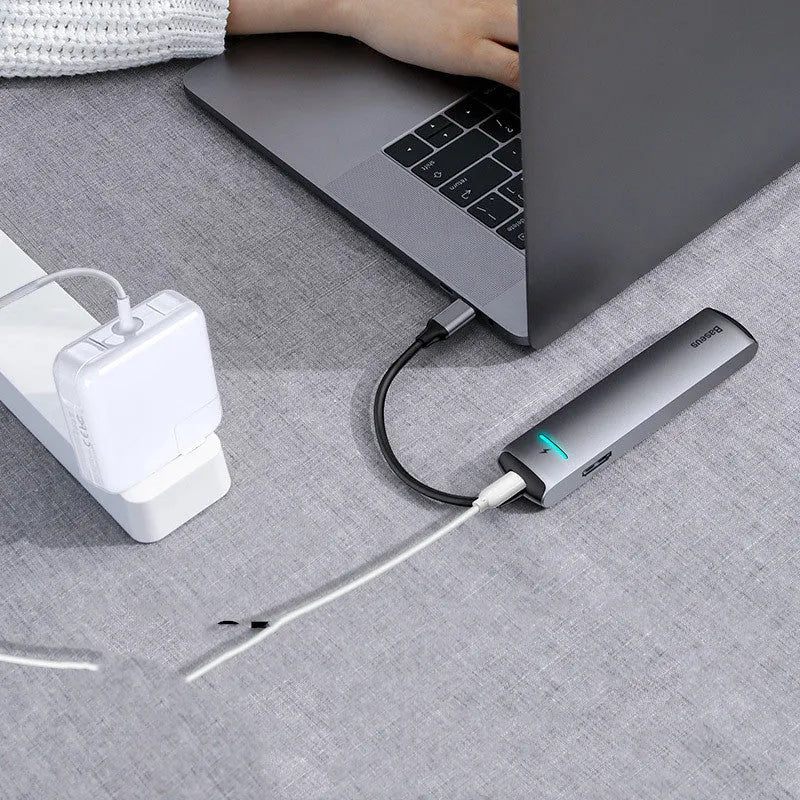 Non-Apple branded Type-C docking station in dark grey with mechanical eye design compatible with MacBook and iPhone