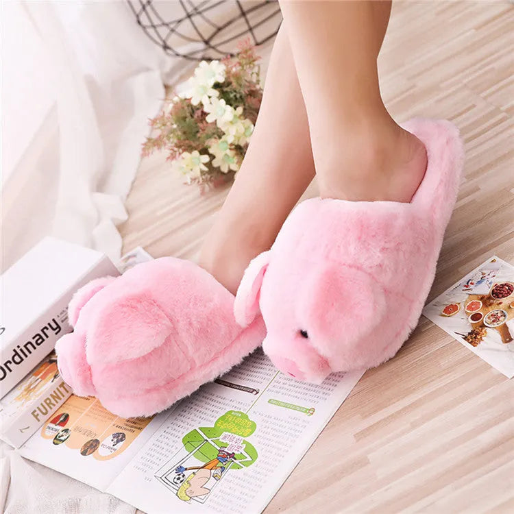 Pink pig-themed floor slippers with short plush exterior.