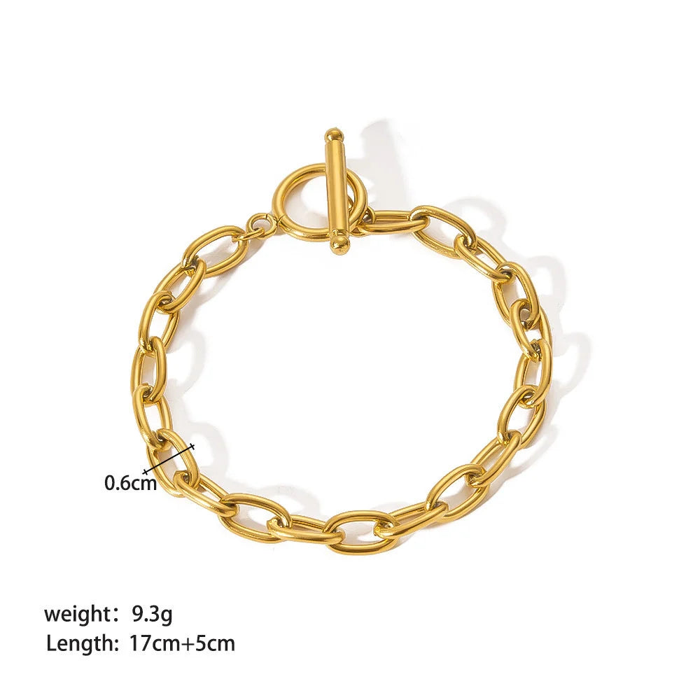 Stainless steel ornament bracelet with real gold treatment in various colours