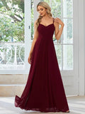Long pleated A-line dress in light green with sleeveless sling neckline design.