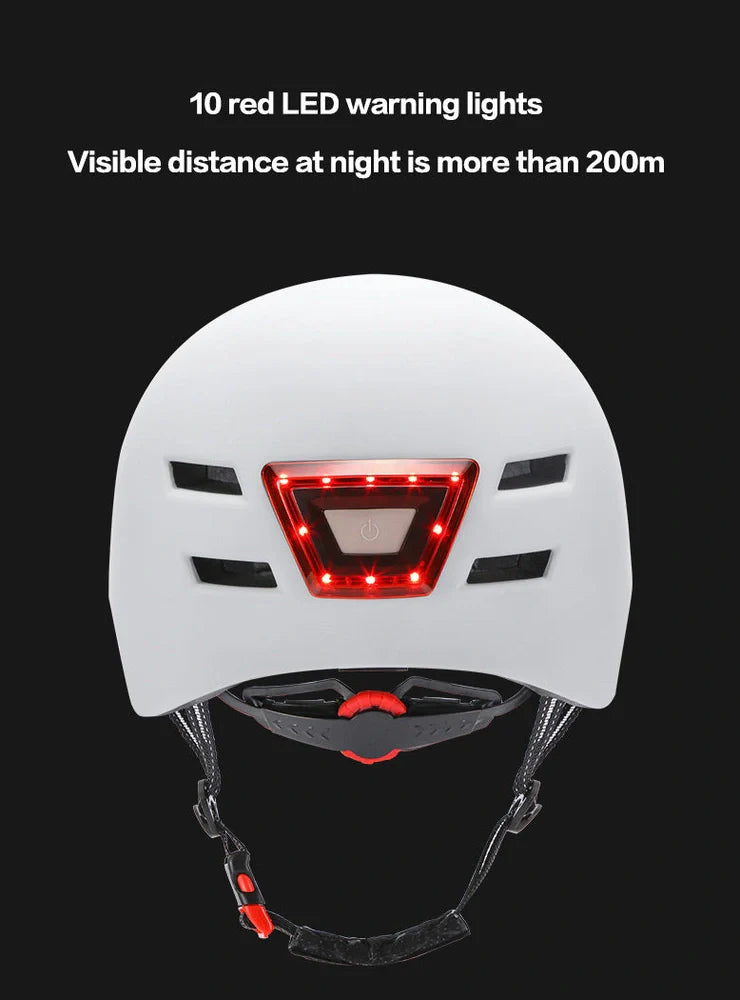 Black cycling helmet with built-in LED headlight and taillight showing adjustable dial and ventilation ports