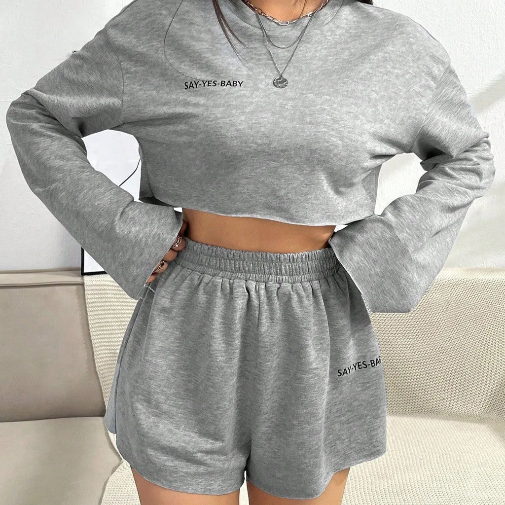 Women's grey long-sleeved t-shirt and shorts matching polyester set laid flat showing both pieces